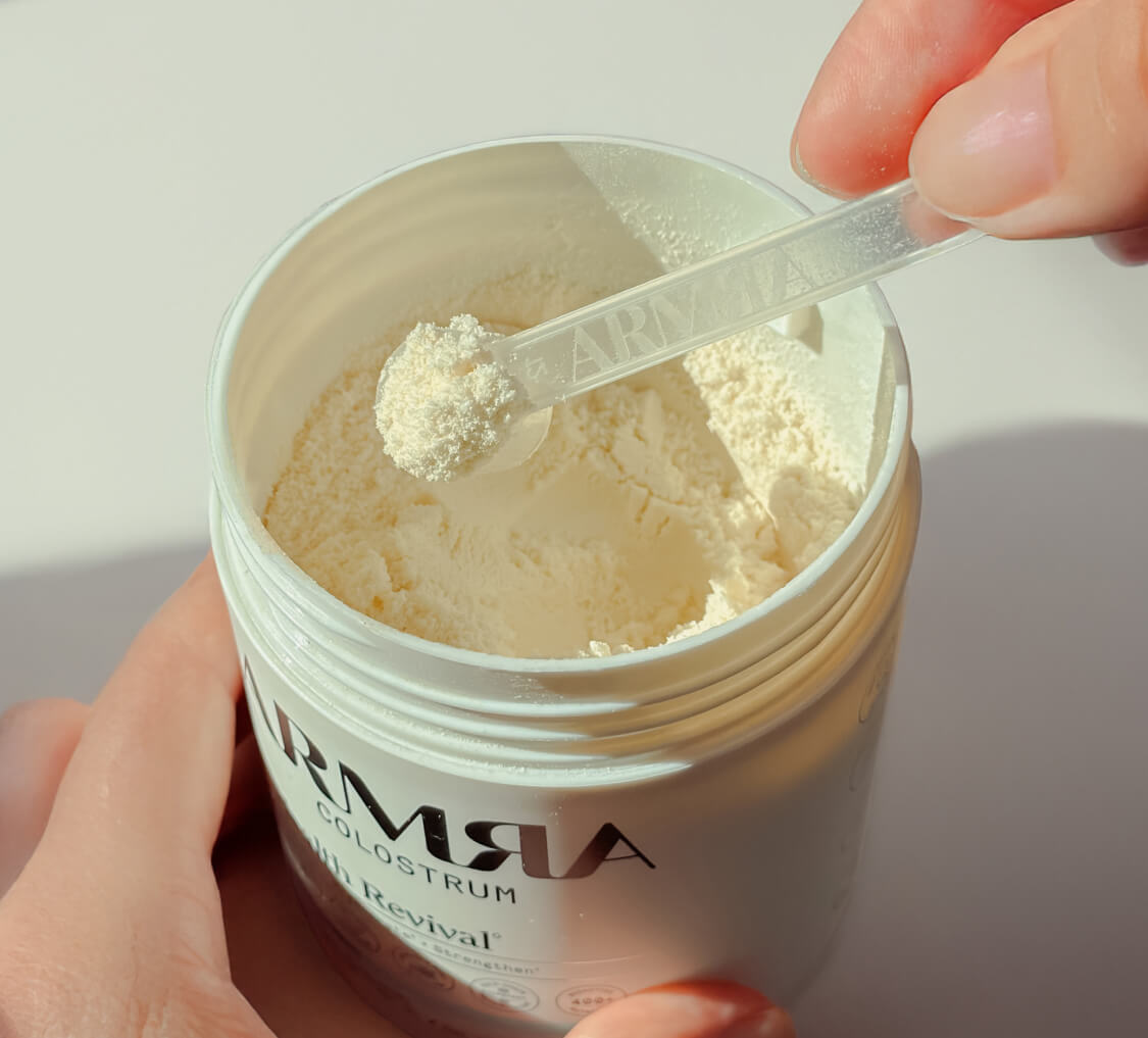 ARMRA Colostrum powder scoop close-up
